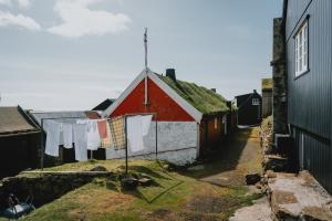 The tiny village in the Faroe Islands is called Mykines. Sunny day, laundry hanging outside. Taken by Daniel Casson. 